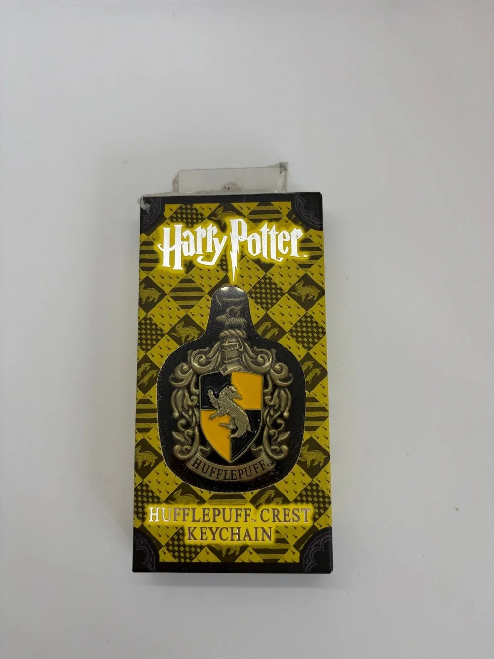 Warner Bros. Harry Potter Hufflepuff Crest Keychain - Yellow & Black